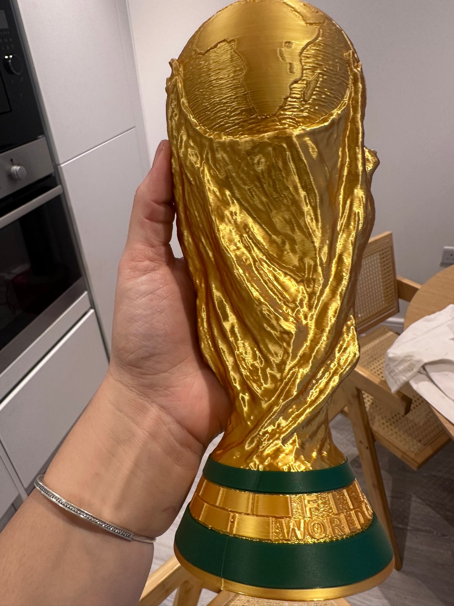 Close view of the real World Cup trophy replica with FIFA World Cup base
